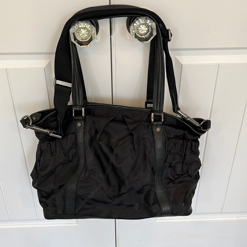 Like new Burberry baby bag.  Great as a regular tote with crossbody strap.